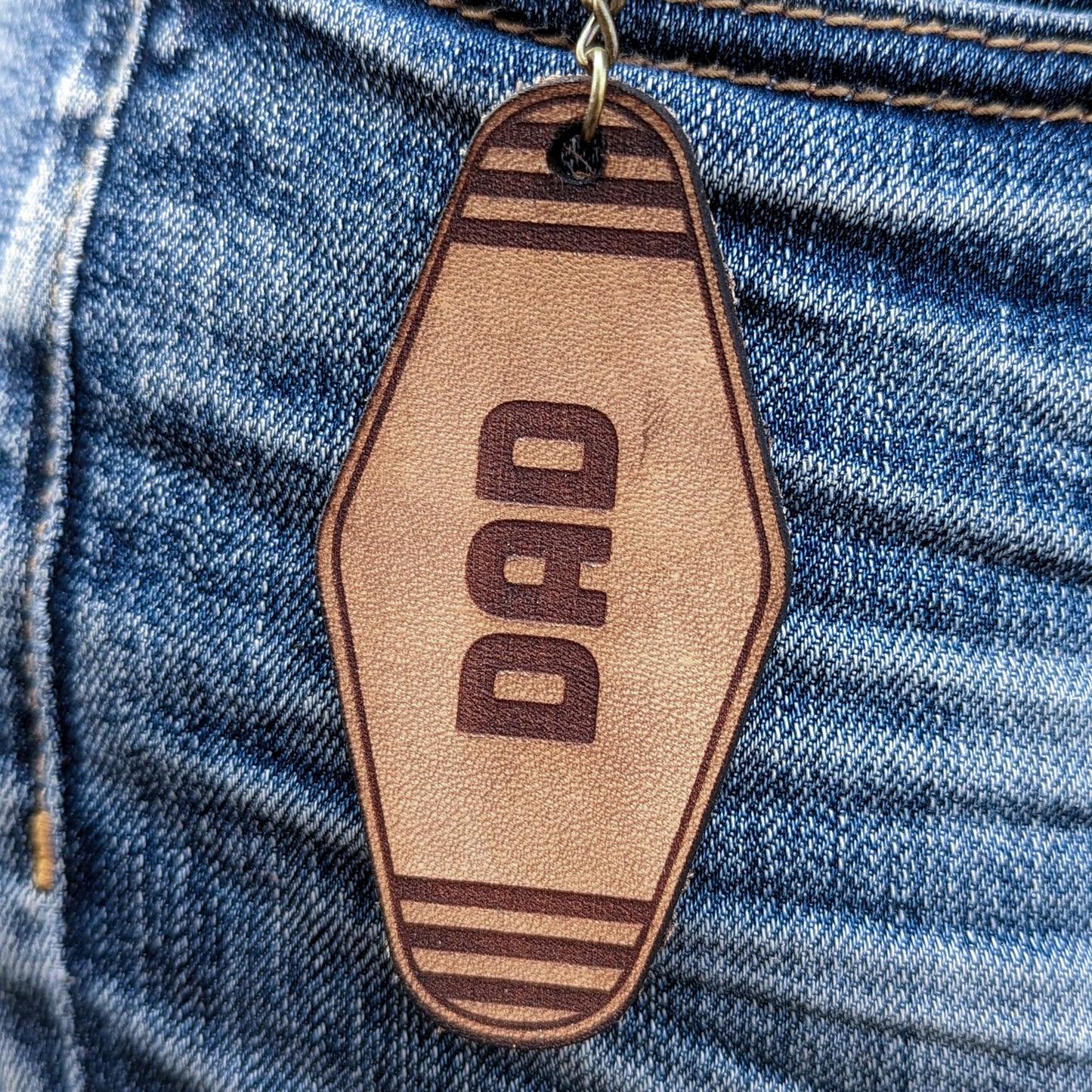 Leather Keychain cut and engraved to look like a vintage motel key with Dad engraved on it.