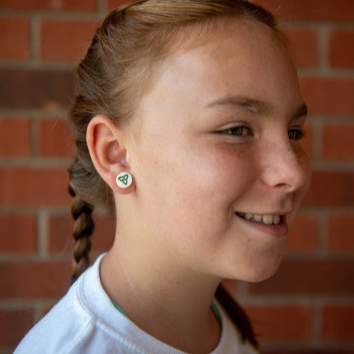 Young girl profile showing her trillium earring from the Franco Ontarien earrings from Cabin Design Co