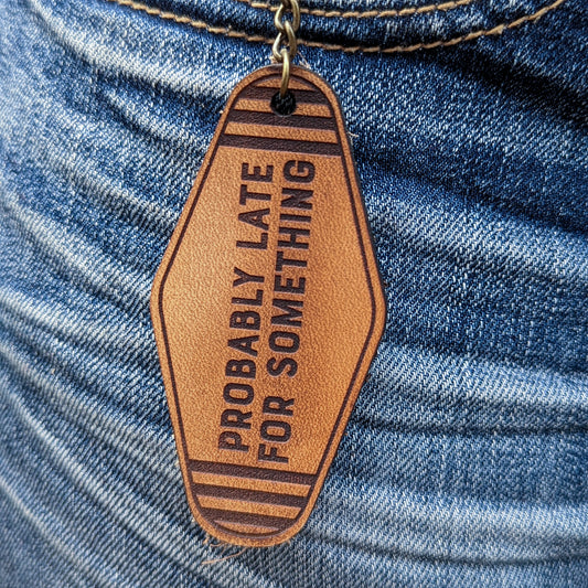 Leather Keychain cut and engraved to look like a vintage motel key with Probably Late for Something engraved on it.